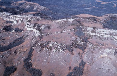 Aerial photograph of the southeast end of South Killdeer Mountain. The trail leading up to Medicine Hole Plateau is visible in the foreground. 